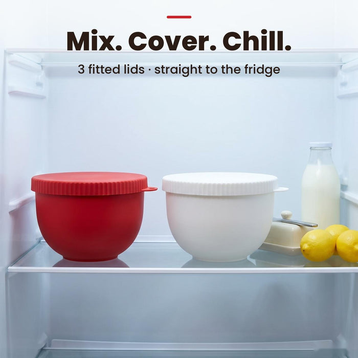 Red and white silicone liners covered with their lids in the fridge
